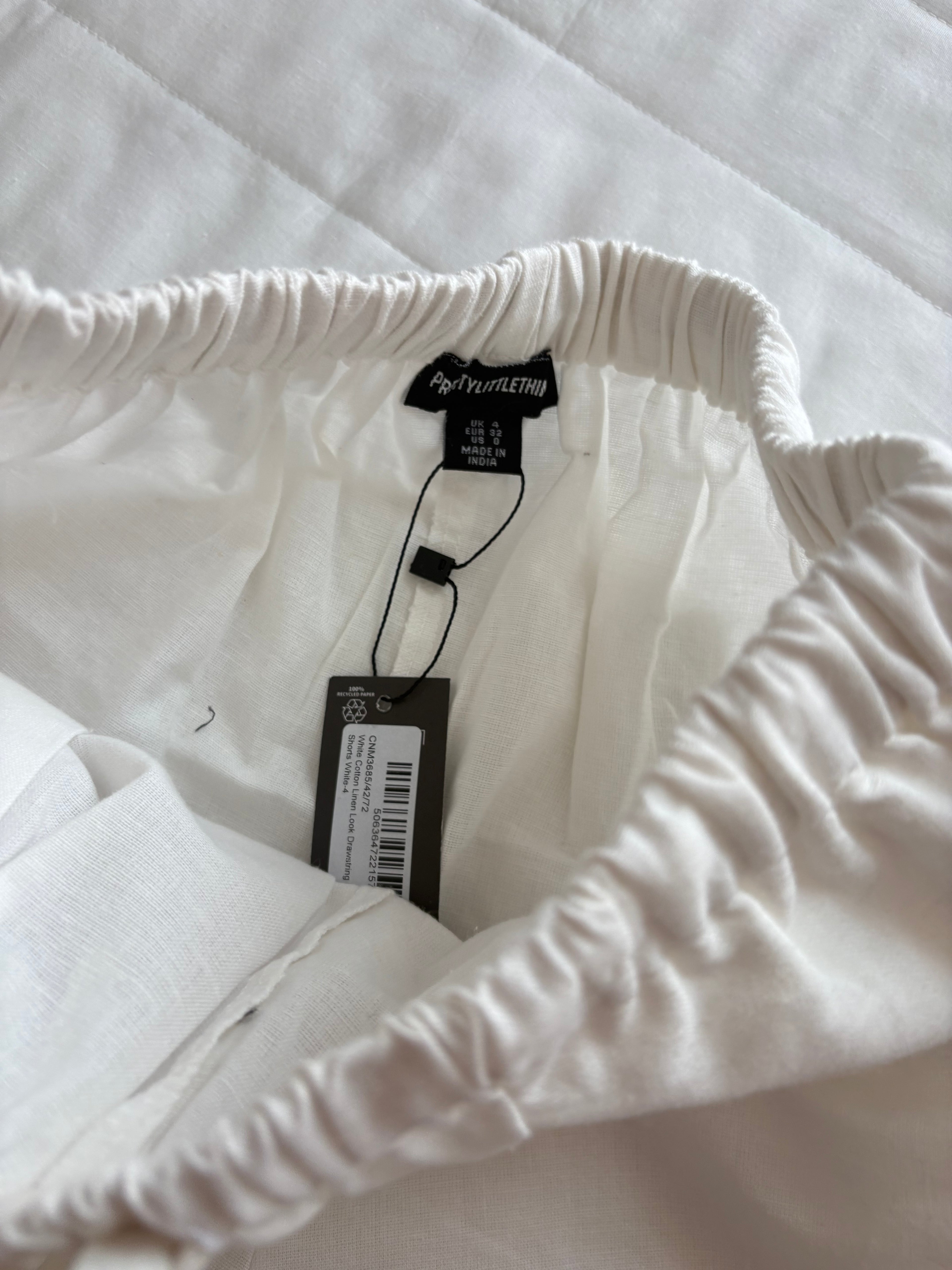 Cotton and linen White top and shorts (sold individually)