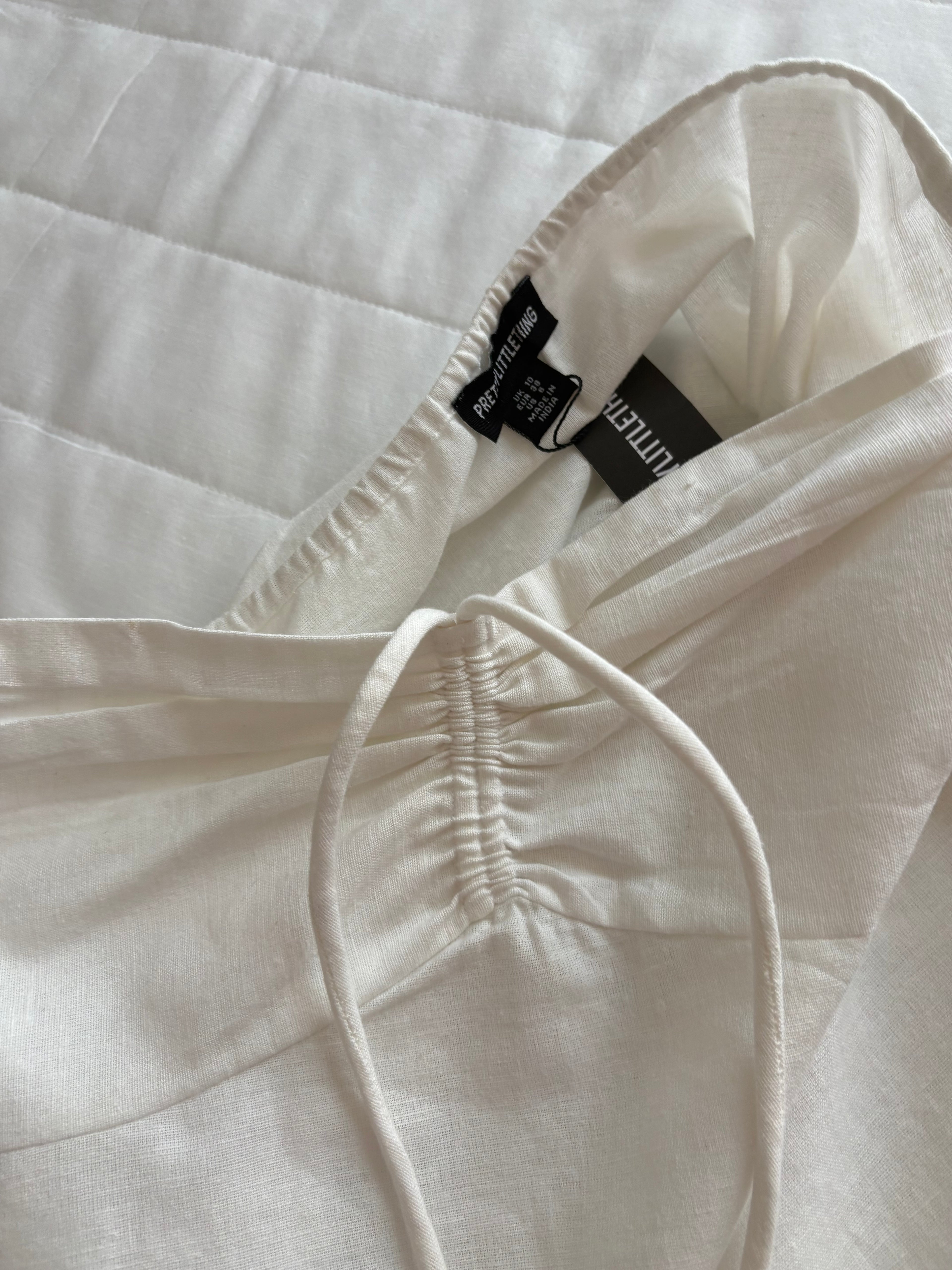 Cotton and linen White top and shorts (sold individually)